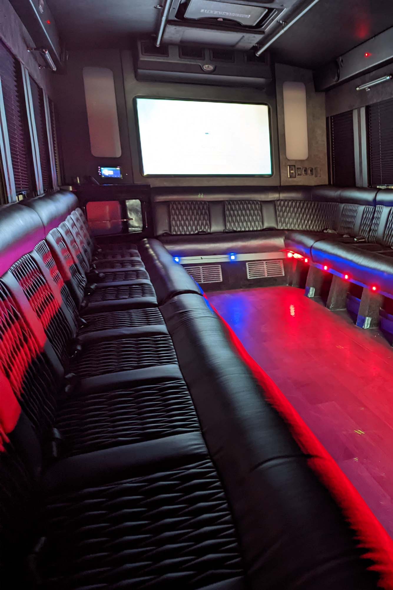 Party bus interior with red lighting